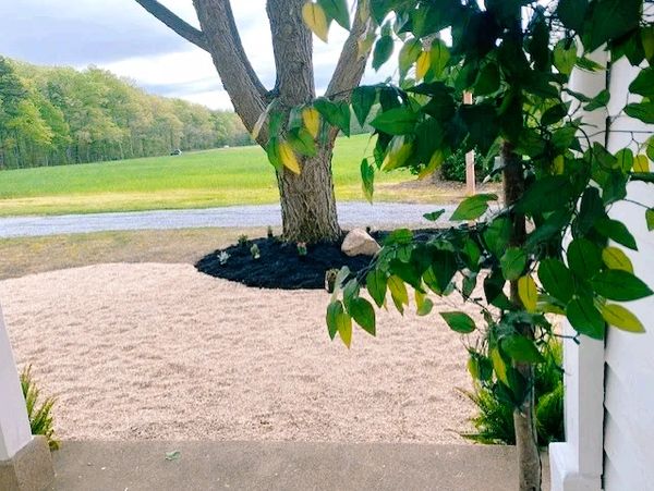 Bright white pea gravel and green grassy fields of the venue