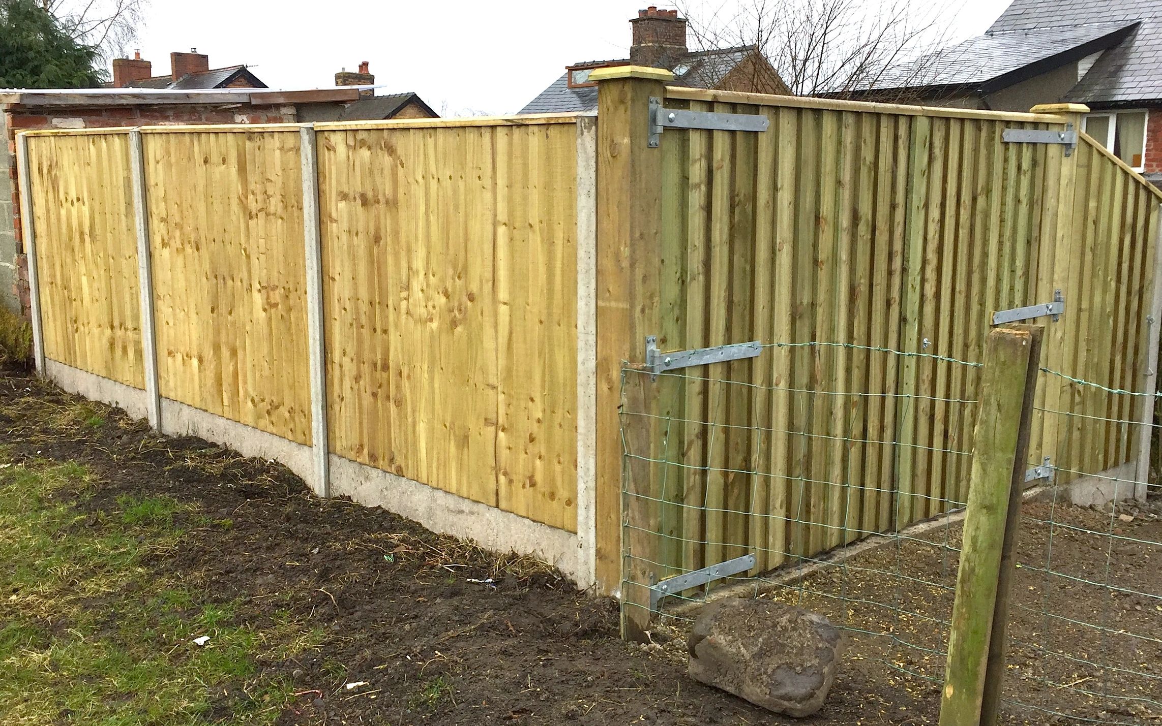 Feather edge fencing with concrete posts and bespoke gates in Llandrindod Wells