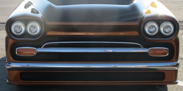 close up image of the front of a 1956 gmc truck 