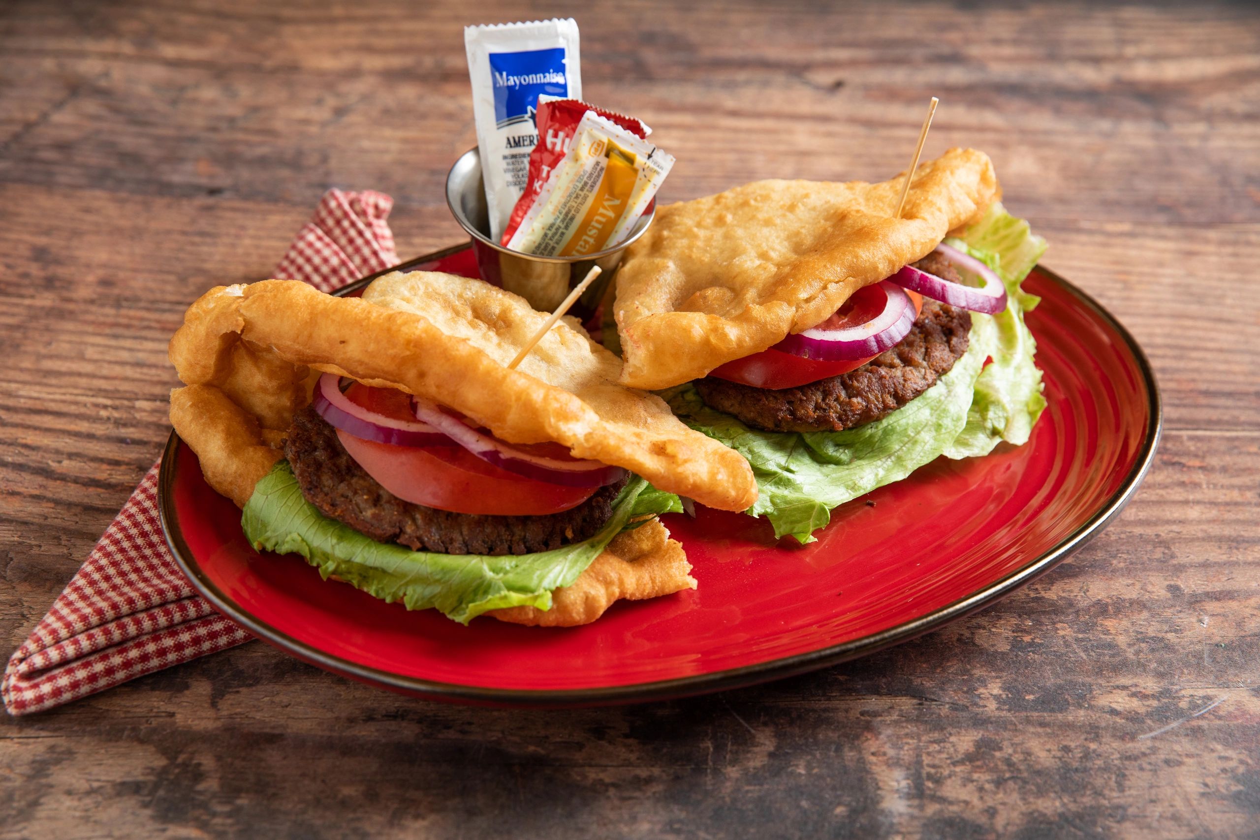 Navajo burgers:
 served with fry bread and two beef patties. choice of lettuce, tomatoes, and onions