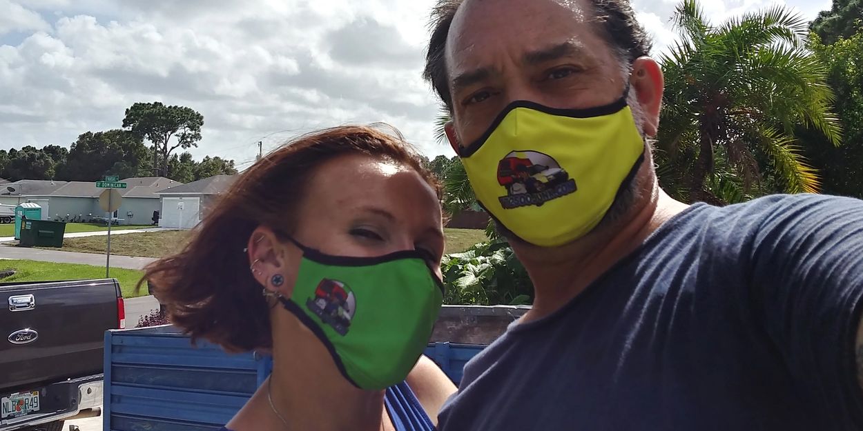 Ashley & James of A & J's Removal Services, wearing their safety masks with our new company logo. 