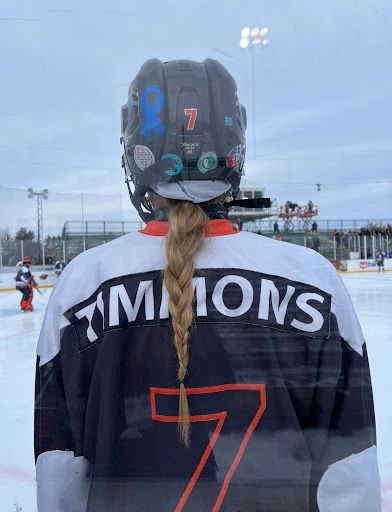 White Bear Lake’s Junior Forward Zoe Timmons showing support with her Teal Sophie’s Squad Stickers.