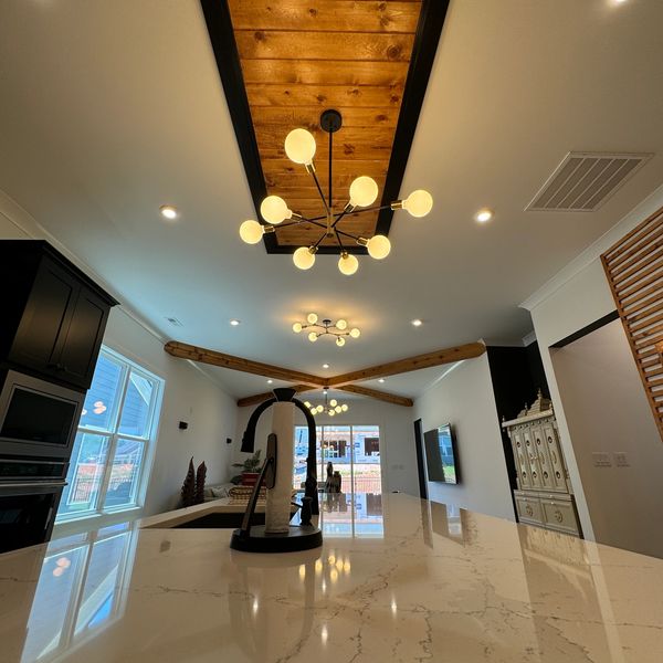 Modern Ceiling Design with Wood Beam Accents and Chandelier – NANDA Trim