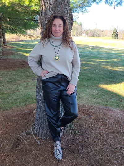 Full-length picture of Jenny standing by a tree