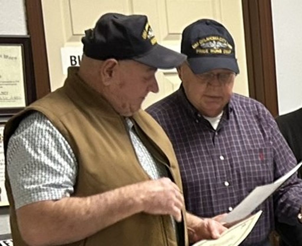 Frank (left) is presented his Holland Club Certificate by Base Commander Chuck Hladik.