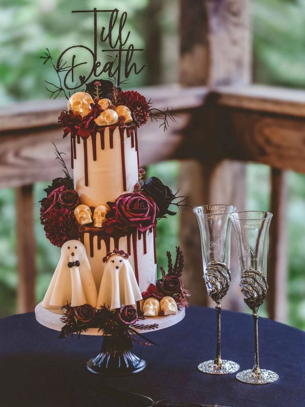Til Death do us part wedding cake. 2 tier lemon blueberry and jack daniels. Chocolate skulls
