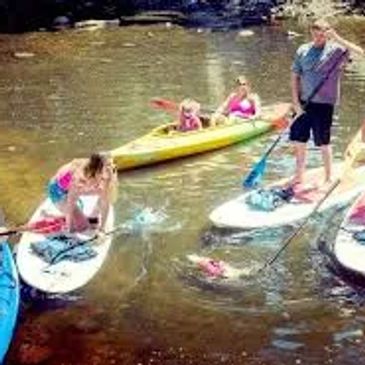 a group enjoying kayak and SUP paddleboard rental on lake lure and lake adger