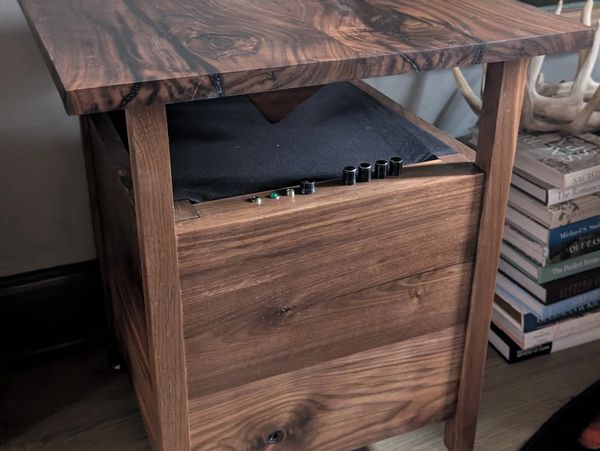 Wooden side table with integrated bluetooth.