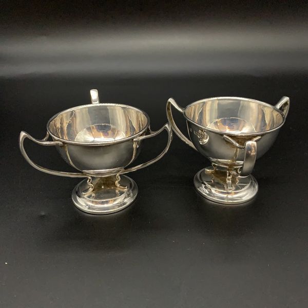 a pair of victorian sterling silver three handled tygs or loving cups.  Either large egg cups or jam