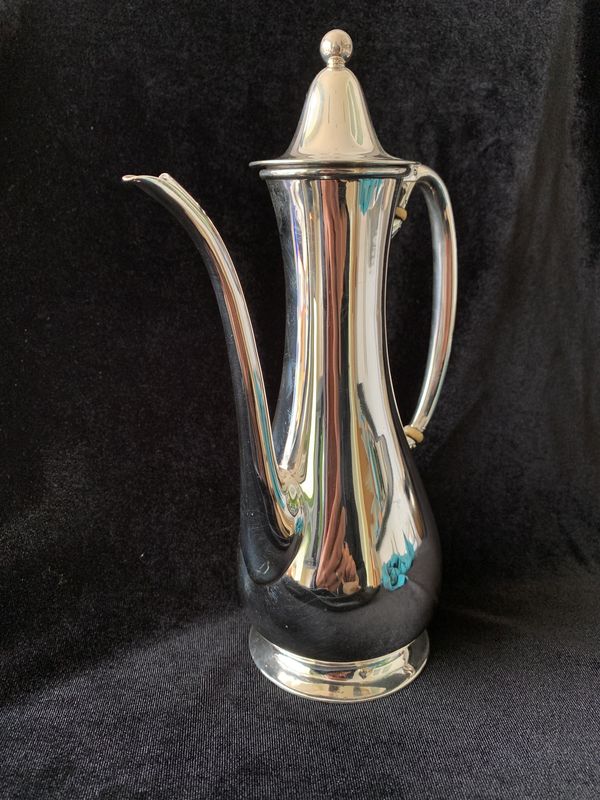 A sterling silver persian style coffee pot by Tiffany of New York with full London import hallmarks