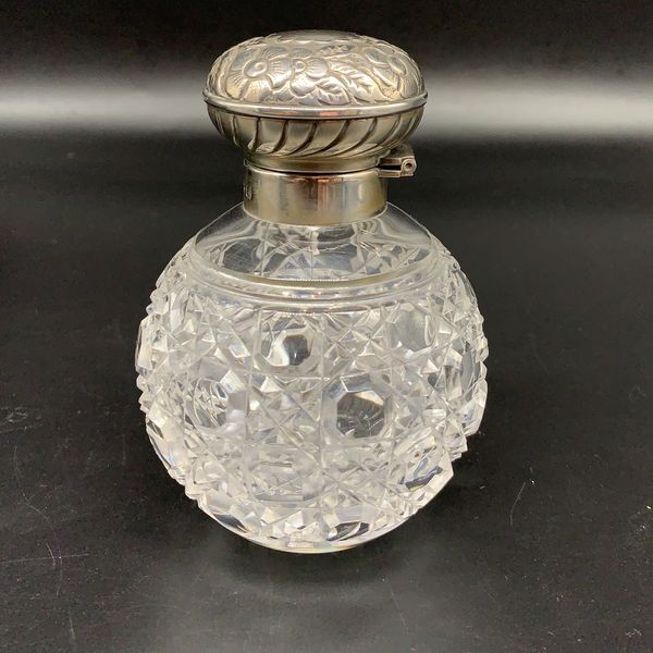 Replica Victorian or Edwardian cut glass flip top perfume bottle with sterling silver top and mount