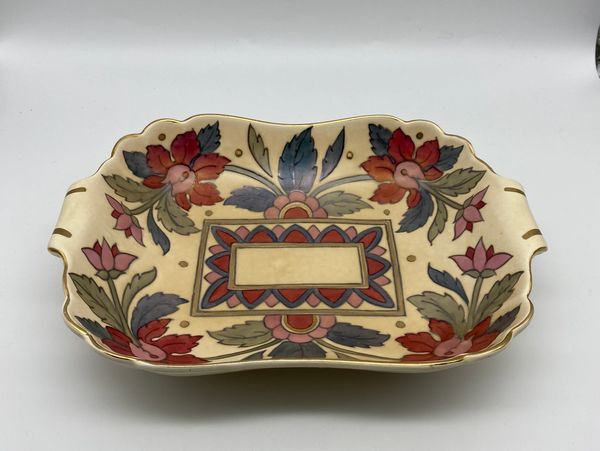 Crown Ducal Ankara pattern flat dish in dark pink  blue and grey after a s charlotte rhead design