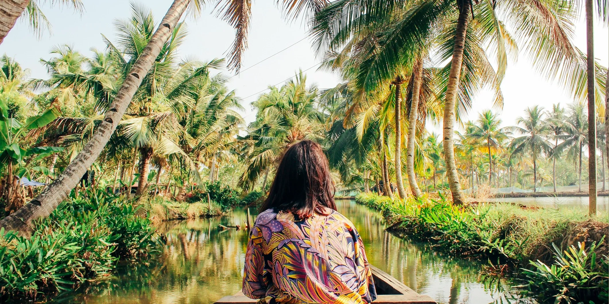 A traveler surrounded by tropical greenery