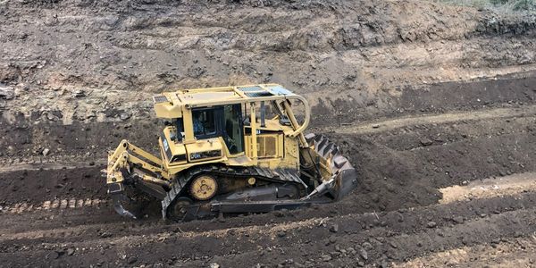Leveling soil for a contour bank