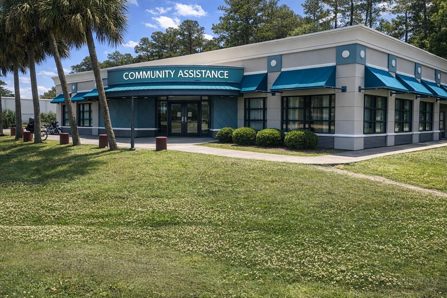 Community Assistance building with blue awnings.