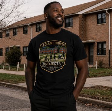 Man wearing a black T-shirt with LeClaire Courts Projects design.