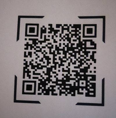 A clear black and white QR code on a white background.