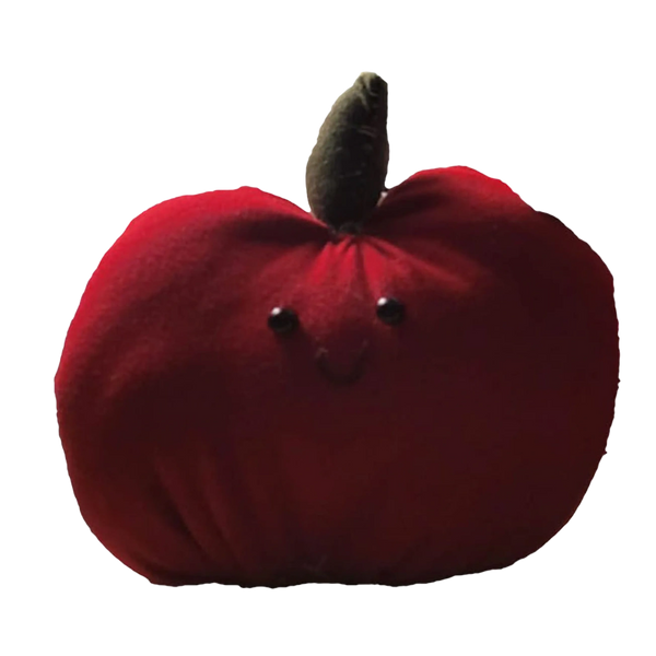 A small plush pumpkin with a happy face and brown stem.