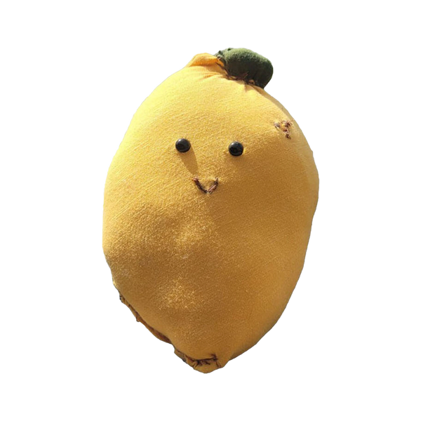 A cute, smiling lemon plush toy with a small green leaf on top.