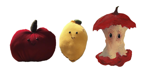 Three cute plush fruits with smiling faces: a red apple, a yellow lemon, and an apple core.