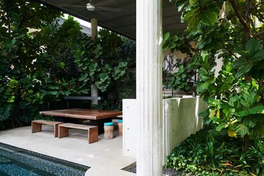 interior photography of a lush backyard at 44 Kasai Road, Singapore