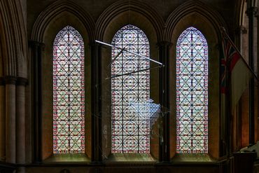 interior photography of Mona Hatoum's Map with stained glass in the background Canterbury Cathedral