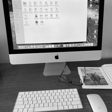 Apple Mac computer and keyboard on desk 