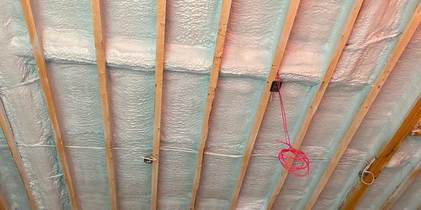 Closed cell foam installation in a bonus room floor system 