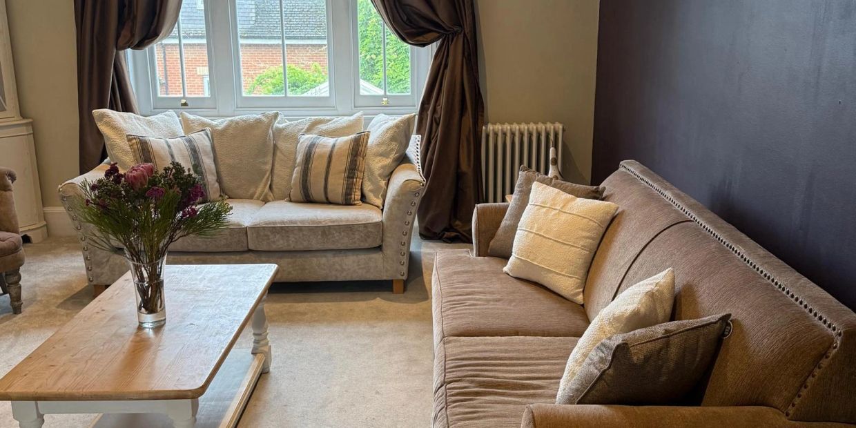Cozy living room with two sofas and a coffee table.