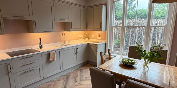 Bright kitchen with modern cabinets and large window.