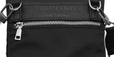 Black crossbody bag with silver zipper and strap hooks.