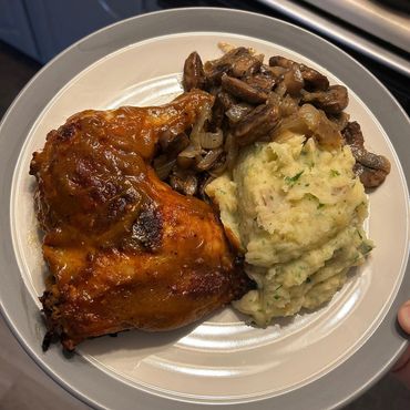 pumpkin roasted chicken leg with mashed potatoes and mushroom medley