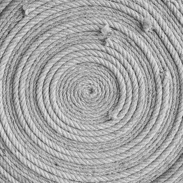 Close-up of coiled rope forming a circular pattern.