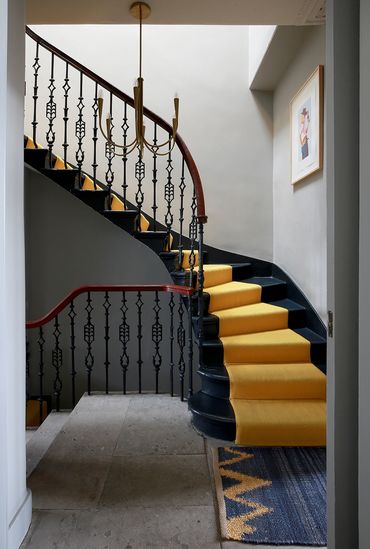 Staircase with yellow carpet in grade II listed Georgian house - The House In Edinburgh
