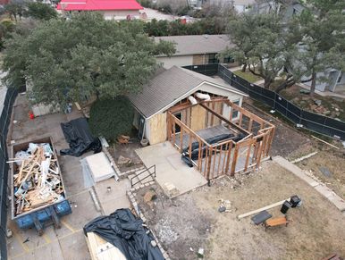 Construction site with a wooden frame structure.