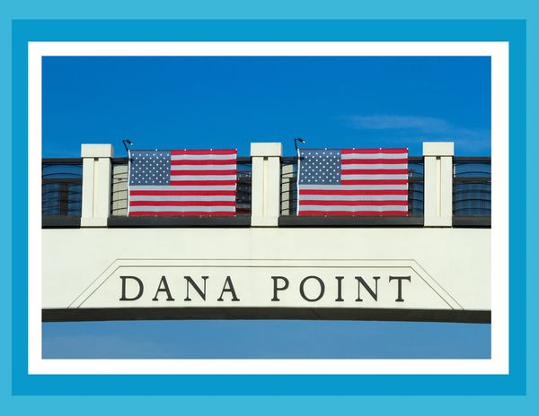 Dana Point Bridge with Stars and Stripes hanging flags.