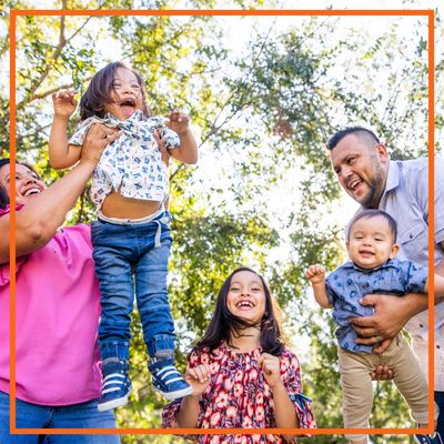 A happy family in a park.