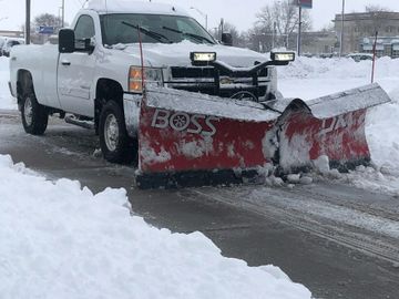 Snow being plowed on a commercial site by Alpha Lawn Care LLC in Kearney Ne