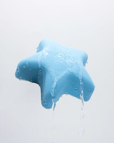 online store photograph for Cosi Care product with water splashing over product for e-commerce shot
