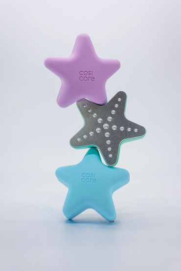 commercial product photography for Cosi care products showing products balanced in tower for socials