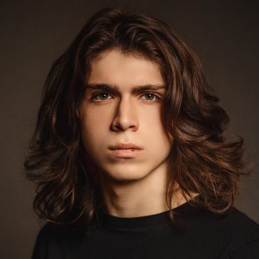 Modern professional headshot of a smiling client, full gallery available