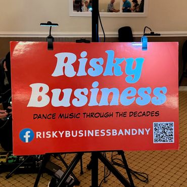 Sign for Risky Business dance band.