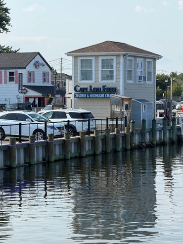 Waterfront building with charter service sign.