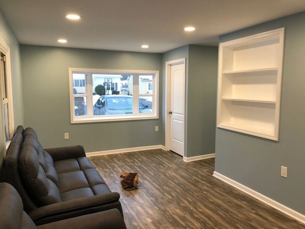 built-in bookshelf, bay window, garage to Livingroom conversion, luxury vinyl tile, handyman, remode