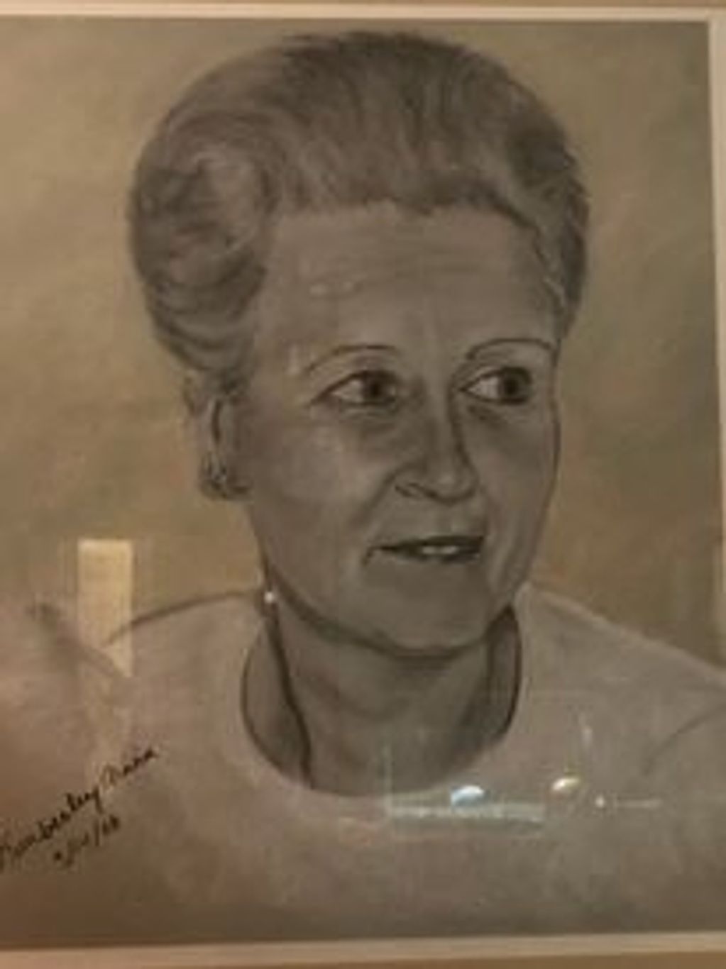 Black and white portrait of an elderly woman looking to the side.
