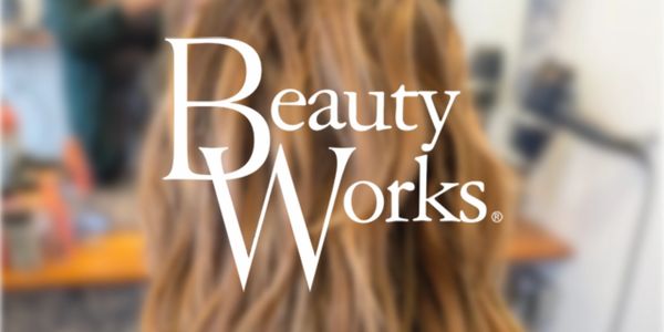 Logo of Beauty Works over a blurred background of long hair.