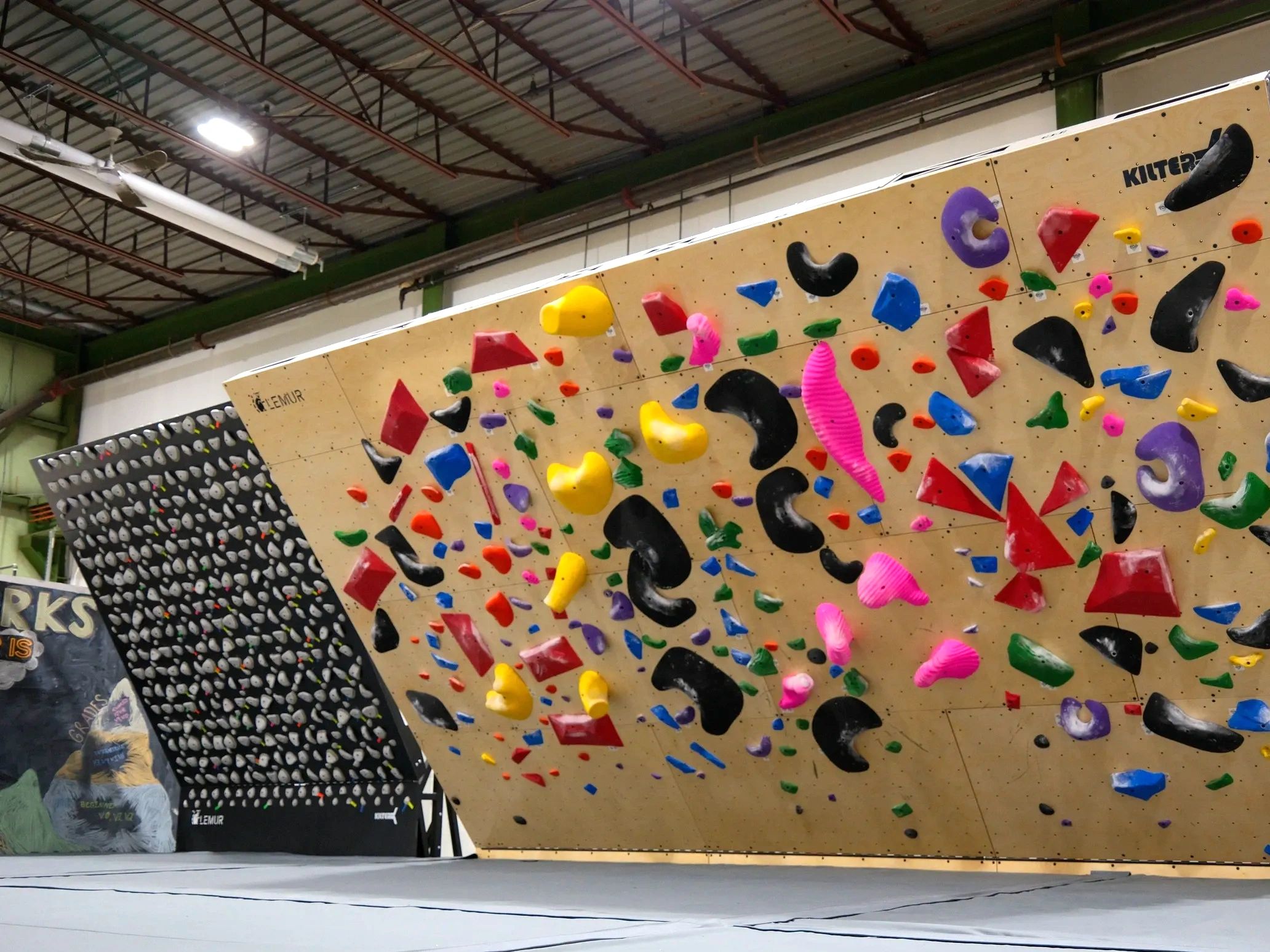 Kilter board and Kilter slab for an indoor bouldering only rock climbing facility