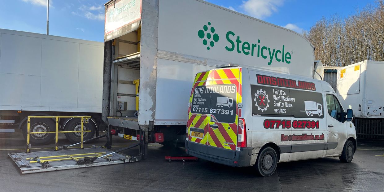 Picture of DMS Van with white lorry whose tail lift is being repaired.