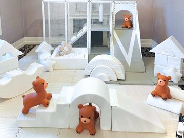 Soft play area with teddy bear toys.