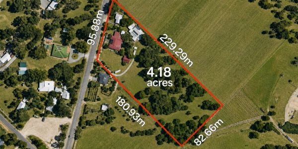 Aerial view of a 4.18-acre property outlined in red with measurements.